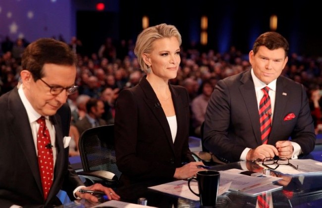 Fox News Channel anchors and debate moderators (L-R) Chris Wallace, Megyn Kelly and Bret Baier begin the Fox News debate for the top 2016 U.S. Republican presidential candidates in Des Moines, Iowa, in this file photo taken January 28, 2015. REUTERS/Carlos Barria/Files