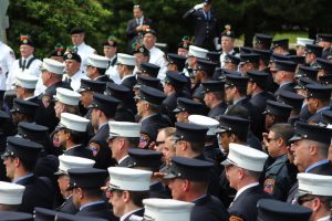 Firefighters salute during the playing of "Amazing Grace" at the funeral for FDNY Battalion Chief Lawrence Stack on Friday, June 17, 2016, in St. James, N.Y. Stack died in the Sept. 11, 2001 terrorist attacks at the World Trade Center. (AP Photo/Frank Eltman)