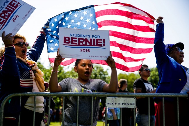 From left, Myrna Leon, her daughter Bella Leon and her mother Frances Hernandez cheer for U.S. Democratic presidential candidate Bernie Sanders at a campaign rally in Stockton, California, United States, May 10, 2016. REUTERS/Max Whittaker