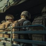 military personnel in a truck