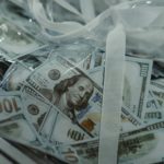 $100 bills in plastic bag