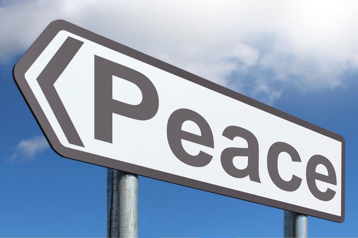 highway sign that reads "peace"